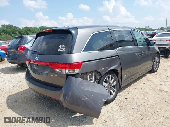 2014 Honda Odyssey Touring with VIN 5FNRL5H99EB138952, listed as a IAAI auction lot 42538833 with 146,959 mi miles and . Bid and sale history available at DreamBid. Image 4.