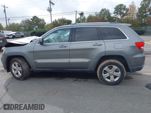 2012 Jeep Grand Cherokee Laredo with VIN 1C4RJFAG8CC298268, listed as a IAAI auction lot 40787833 with 206,486 mi miles. Bid and sale history available at carsss.com. Image 13.