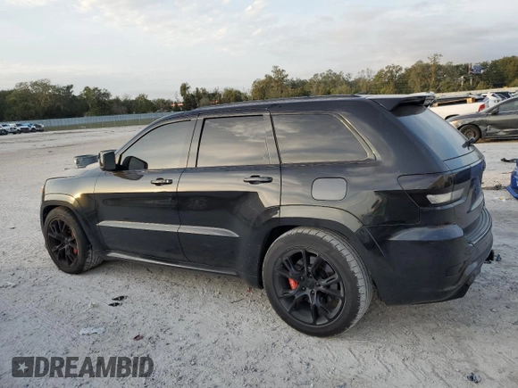 2012 Jeep Grand Cherokee SRT8 with VIN 1C4RJFDJ2CC329621, listed as a Copart auction lot 86772154 with 236,800 mi miles and Salvage Title. Bid and sale history available at carsss.com. Image 2.