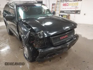 1999 GMC Jimmy SLS Comfort/Convenience with VIN 1GKCT18W1XK503719, listed as a IAAI auction lot 41536310 with 151,211 mi miles. Bid and sale history available at carsss.com. Image 6.
