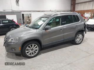 2011 Volkswagen Tiguan SE with VIN WVGBV7AX9BW524807, listed as a IAAI auction lot 41921439 with 204,813 mi miles and . Bid and sale history available at DreamBid. Image 2.