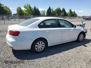 2014 Volkswagen Jetta S with VIN 3VW2K7AJ2EM303673, listed as a Copart auction lot 62909235 with 69,592 mi miles and Salvage title. Bid and sale history available at DreamBid. Image 3.