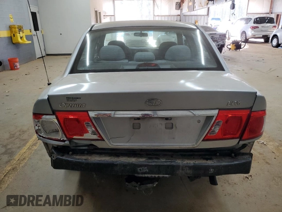 2005 Kia Optima LX z VIN KNAGD128155423463, wystawiony jako Copart lot #87441284 z przebiegiem 143 193 mil mil oraz Szkoda całkowita • Salvage title. Historia ofert i sprzedaży dostępna na DreamBid. Obrazek 6.