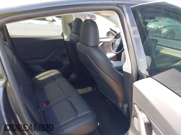 2024 Tesla Model Y with VIN 7SAYGDED3RF019063, listed as a IAAI auction lot 42061888 with 13,763 mi miles and . Bid and sale history available at DreamBid. Image 8.