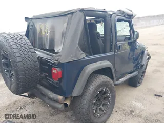 2003 Jeep Wrangler X with VIN 1J4FA39S23P300447, listed as a IAAI auction lot 41791733 with 165,576 mi miles. Bid and sale history available at carsss.com. Image 4.