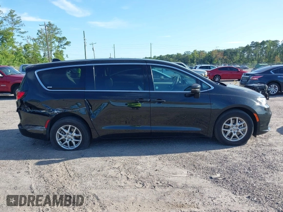 2023 Chrysler Pacifica Touring L with VIN 2C4RC1BG1PR606566, listed as a IAAI auction lot 42615498 with 42,980 mi miles and . Bid and sale history available at DreamBid. Image 13.