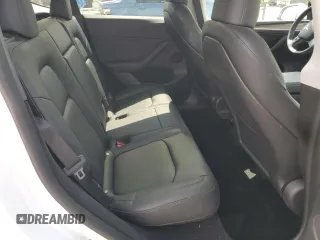2023 Tesla Model Y Long Range z VIN 7SAYGDEE8PA030286, wystawiony jako Copart lot #50945465 z przebiegiem 43 676 mil mil oraz Szkoda całkowita • Salvage title. Historia ofert i sprzedaży dostępna na DreamBid. Obrazek 11.