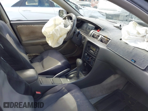 1999 Toyota Camry LE z VIN JT2BF22K2X0164080, wystawiony jako IAAI lot #40984874 z przebiegiem Nie podano mil oraz . Historia ofert i sprzedaży dostępna na DreamBid. Obrazek 5.