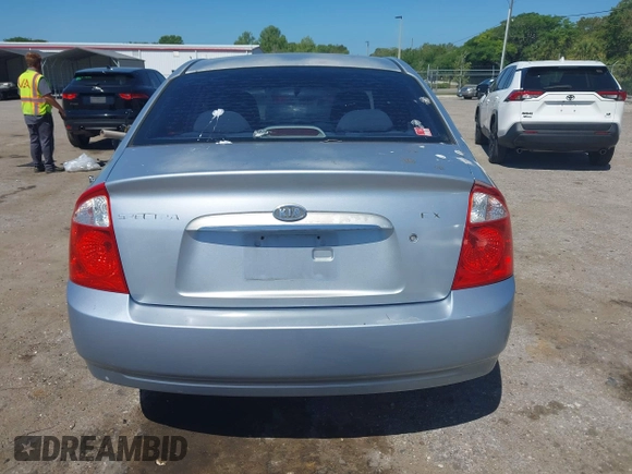 2005 Kia Spectra LX with VIN KNAFE121955107403, listed as a IAAI auction lot 42055036 with 157,605 mi miles. Bid and sale history available at carsss.com. Image 16.