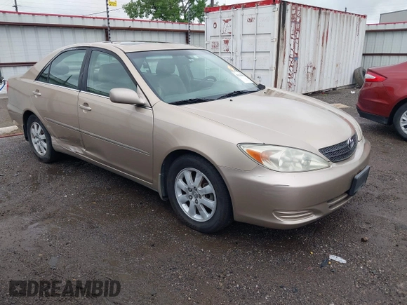 2002 Toyota Camry LE z VIN 4T1BE32K52U086150, wystawiony jako IAAI lot #42126685 z przebiegiem 175 212 mil mil oraz . Historia ofert i sprzedaży dostępna na DreamBid. Obrazek 1.