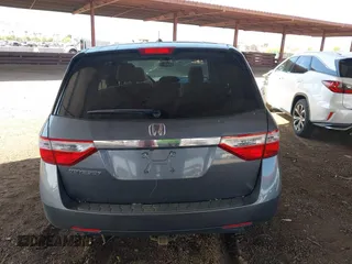 2012 Honda Odyssey EX-L with VIN 5FNRL5H6XCB103498, listed as a IAAI auction lot 42065658 with 104,933 mi miles and . Bid and sale history available at carsss.com. Image 16.