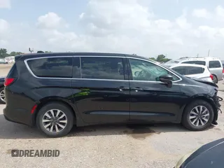 2023 Chrysler Pacifica Hybrid Touring L with VIN 2C4RC1L75PR611901, listed as a IAAI auction lot 42626500 with 44,156 mi miles and . Bid and sale history available at DreamBid. Image 13.