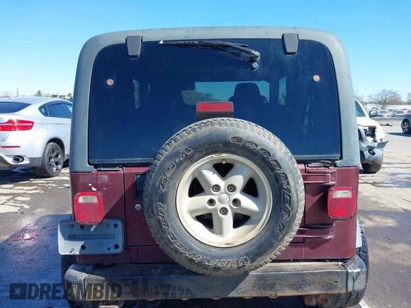 2003 Jeep Wrangler Sport with VIN 1J4FA49S33P345192, listed as a IAAI auction lot 41801344 with 196,472 mi miles. Bid and sale history available at carsss.com. Image 16.