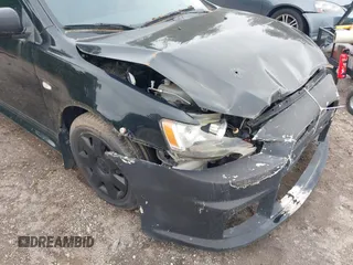 2011 Mitsubishi Lancer ES z VIN JA32U2FU0BU043024, wystawiony jako IAAI lot #42367152 z przebiegiem 167 655 mil mil oraz . Historia ofert i sprzedaży dostępna na DreamBid. Obrazek 14.