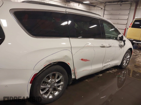 2021 Chrysler Pacifica Touring L with VIN 2C4RC1BG3MR504293, listed as a IAAI auction lot 41728608 with 70,487 mi miles and . Bid and sale history available at DreamBid. Image 19.