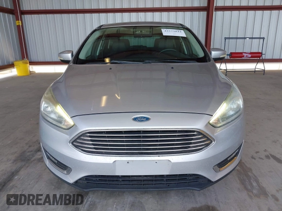 2017 Ford Focus Titanium z VIN 1FADP3N2XHL288103, wystawiony jako IAAI lot #42573844 z przebiegiem 128 952 mil mil oraz . Historia ofert i sprzedaży dostępna na DreamBid. Obrazek 13.