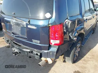 2011 Honda Pilot Touring with VIN 5FNYF4H92BB090056, listed as a IAAI auction lot 42010682 with 201,640 mi miles. Bid and sale history available at carsss.com. Image 17.