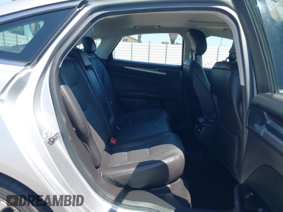 2014 Ford Fusion Titanium with VIN 3FA6P0K96ER248025, listed as a IAAI auction lot 42189061 with 64,351 mi miles and . Bid and sale history available at DreamBid. Image 8.