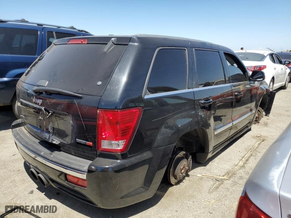 2007 Jeep Grand Cherokee SRT-8 with VIN 1J8HR78387C603473, listed as a Copart auction lot 57712964 with 114,429 mi miles and Salvage Title. Bid and sale history available at carsss.com. Image 3.
