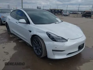 2021 Tesla Model 3 Long Range with VIN 5YJ3E1EB9MF059554, listed as a IAAI auction lot 41231520 with 63,696 mi miles and . Bid and sale history available at DreamBid. Image 1.