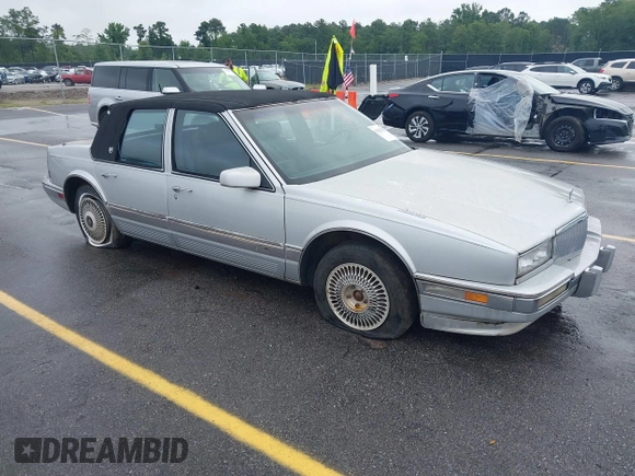 1991 Cadillac Seville z VIN 1G6KS53B2MU813855, wystawiony jako IAAI lot #42425470 z przebiegiem 168 194 mil mil oraz . Historia ofert i sprzedaży dostępna na DreamBid. Obrazek 1.