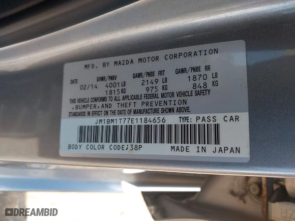 2014 Mazda Mazda3 i SV with VIN JM1BM1T77E1184656, listed as a IAAI auction lot 41703402 with 57,025 mi miles. Bid and sale history available at carsss.com. Image 9.