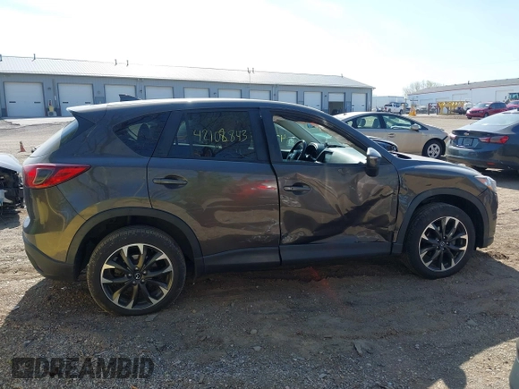 2016 Mazda CX-5 Grand Touring z VIN JM3KE4DY8G0846265, wystawiony jako IAAI lot #42102843 z przebiegiem 159 827 mil mil oraz . Historia ofert i sprzedaży dostępna na DreamBid. Obrazek 13.