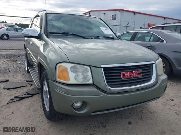 2004 GMC Envoy SLE with VIN 1GKDS13S442240682, listed as a IAAI auction lot 41764185 with 139,348 mi miles. Bid and sale history available at carsss.com. Image 6.