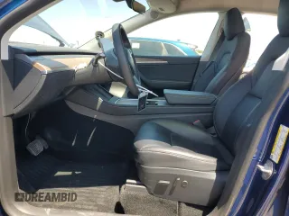 2024 Tesla Model Y z VIN 7SAYGDED9RF005104, wystawiony jako Copart lot #64974545 z przebiegiem 20 422 mil mil oraz Szkoda całkowita • Salvage title. Historia ofert i sprzedaży dostępna na DreamBid. Obrazek 7.