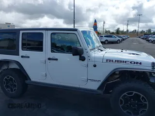2016 Jeep Wrangler Unlimited Rubicon with VIN 1C4HJWFG7GL254143, listed as a IAAI auction lot 41781962 with 114,435 mi miles and . Bid and sale history available at DreamBid. Image 14.