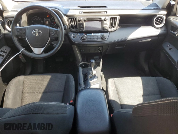 2018 Toyota RAV4 XLE with VIN 2T3WFREV7JW412348, listed as a Copart auction lot 49973215 with 127,661 mi miles and Salvage Title. Bid and sale history available at DreamBid. Image 8.