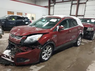 2016 Ford Escape Titanium with VIN 1FMCU9JX6GUB57497, listed as a IAAI auction lot 41375019 with 1 mi miles. Bid and sale history available at carsss.com. Image 2.