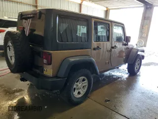 2015 Jeep Wrangler Unlimited Freedom with VIN 1C4BJWDG5FL713046, listed as a Copart auction lot 58563455 with 144,179 mi miles and Salvage title. Bid and sale history available at DreamBid. Image 3.