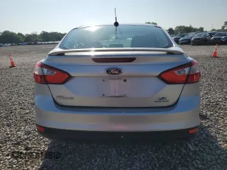 2013 Ford Focus SE with VIN 1FADP3F20DL142026, listed as a Copart auction lot 61855025 with 148,851 mi miles and Salvage title. Bid and sale history available at DreamBid. Image 6.