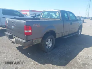 2007 Ford F-150 STX with VIN 1FTRX14W47FA54576, listed as a IAAI auction lot 41971521 with 220,945 mi miles. Bid and sale history available at carsss.com. Image 4.