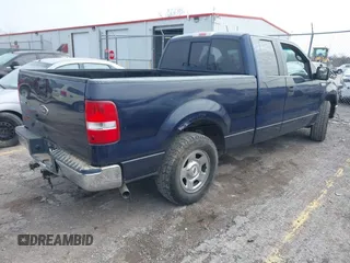 2005 Ford F-150 XLT with VIN 1FTPX12565NA61341, listed as a IAAI auction lot 41693609 with 401,988 mi miles. Bid and sale history available at carsss.com. Image 4.