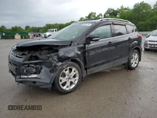 2015 Ford Escape Titanium z VIN 1FMCU9J93FUC22306, wystawiony jako Copart lot #58064785 z przebiegiem 138 063 mil mil oraz Szkoda całkowita • Salvage title. Historia ofert i sprzedaży dostępna na DreamBid. Obrazek 1.
