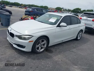 2013 BMW 3 Series 328i with VIN WBA3A5G51DNP26142, listed as a IAAI auction lot 41767977 with 129,440 mi miles. Bid and sale history available at carsss.com. Image 2.