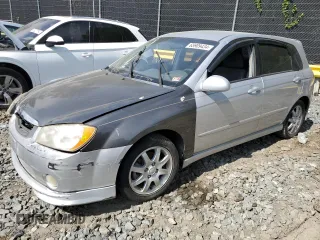 2006 Kia Spectra with VIN KNAFE161X65370270, listed as a Copart auction lot 65909434 with 214,701 mi miles and Salvage Title. Bid and sale history available at carsss.com. Image 1.