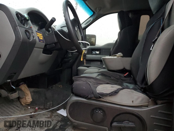 2007 Ford F-150 XL with VIN 1FTRF12257KC92124, listed as a Copart auction lot 50627995 with 142,316 mi miles and Salvage title. Bid and sale history available at DreamBid. Image 7.