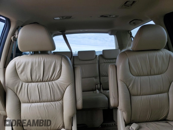 2010 Honda Odyssey Touring with VIN 5FNRL3H94AB056657, listed as a Copart auction lot 72658934 with 202,690 mi miles and Salvage title. Bid and sale history available at DreamBid. Image 10.