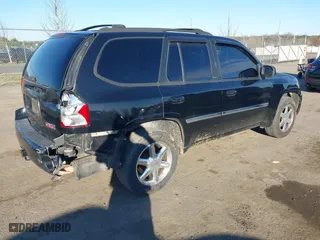 2009 GMC Envoy SLT with VIN 1GKDT43S792132160, listed as a IAAI auction lot 41876839 with 203,236 mi miles. Bid and sale history available at carsss.com. Image 4.