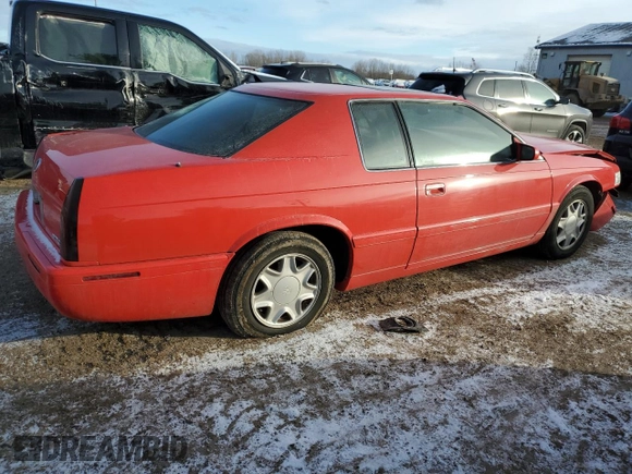 2002 Cadillac Eldorado z VIN 1G6EC12972B106132, wystawiony jako Copart lot #86799624 z przebiegiem 75 334 mil mil oraz Szkoda całkowita • Salvage title. Historia ofert i sprzedaży dostępna na DreamBid. Obrazek 3.