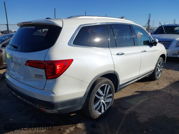 2017 Honda Pilot Touring with VIN 5FNYF6H93HB056387, listed as a IAAI auction lot 41095336 with 90,376 mi miles and . Bid and sale history available at DreamBid. Image 4.