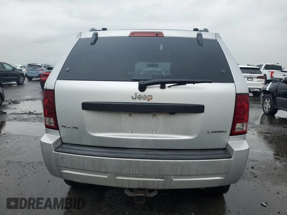 2005 Jeep Grand Cherokee Laredo with VIN 1J4GR48K55C719634, listed as a Copart auction lot 61809195 with 141,316 mi miles and Salvage title. Bid and sale history available at DreamBid. Image 6.