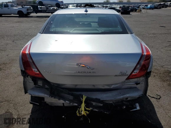 2015 Jaguar XJ with VIN SAJWJ1CD4F8V82496, listed as a Copart auction lot 71013474 with 52,744 mi miles and Salvage title. Bid and sale history available at DreamBid. Image 6.
