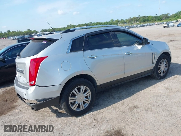 2014 Cadillac SRX Luxury Collection z VIN 3GYFNEE36ES652353, wystawiony jako IAAI lot #42233986 z przebiegiem 146 029 mil mil oraz . Historia ofert i sprzedaży dostępna na DreamBid. Obrazek 4.