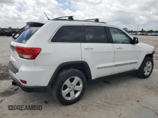 2013 Jeep Grand Cherokee Laredo with VIN 1C4RJEAG4DC517044, listed as a Copart auction lot 51250875 with 150,388 mi miles and Salvage Title. Bid and sale history available at carsss.com. Image 3.