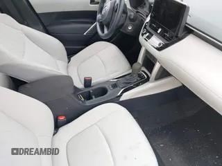 2023 Toyota Corolla Cross L with VIN 7MUAAABG4PV063424, listed as a IAAI auction lot 42119578 with 14,743 mi miles and . Bid and sale history available at DreamBid. Image 5.