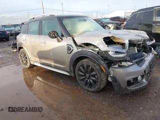 2017 MINI Countryman Cooper S z VIN WMZYT5C37H3D80951, wystawiony jako IAAI lot #41213917 z przebiegiem 121 603 mil mil oraz . Historia ofert i sprzedaży dostępna na DreamBid. Obrazek 1.